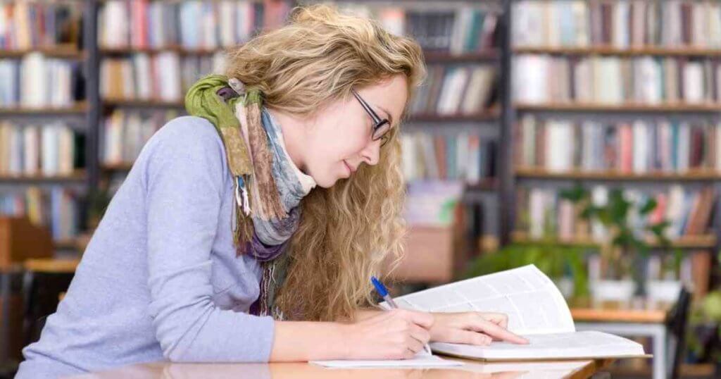 woman focused on reading to get good grades
